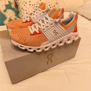 On Running Orange and Gray Athletic Shoes